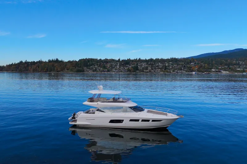 Luna Maris Yacht Photos Pics Luxury 2016 Prestige 550 yacht on serene blue water with scenic background.