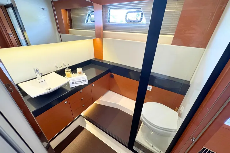 Luna Maris Yacht Photos Pics Luxurious bathroom in 2016 Prestige 550 yacht with modern sink and toilet.