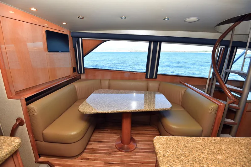Bella Betty Yacht Photos Pics Luxurious interior of 2003 Viking 65 Enclosed Bridge yacht with ocean view.