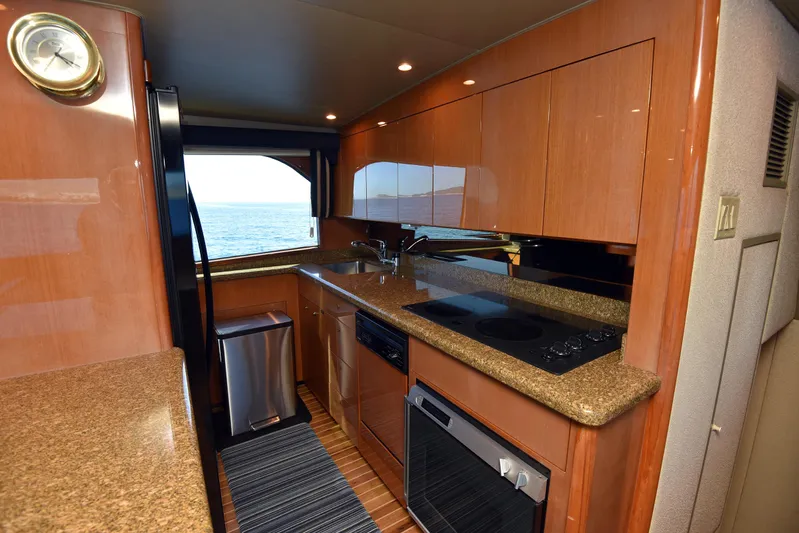 Bella Betty Yacht Photos Pics 2003 Viking 65 Enclosed Bridge yacht kitchen with modern appliances and ocean view.