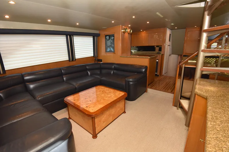 Bella Betty Yacht Photos Pics Luxurious interior of 2003 Viking 65 Enclosed Bridge yacht with leather seating and wooden accents.