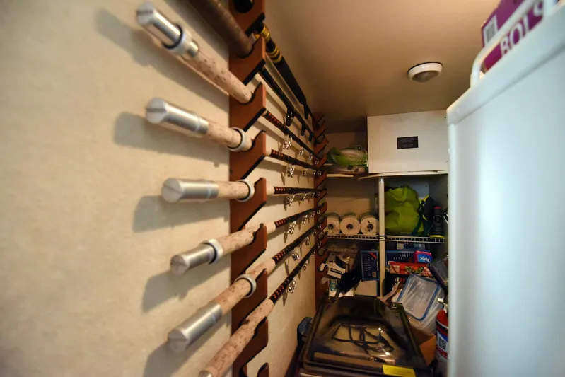 Bella Betty Yacht Photos Pics Fishing rod storage in a 2003 Viking 65 Enclosed Bridge yacht interior.