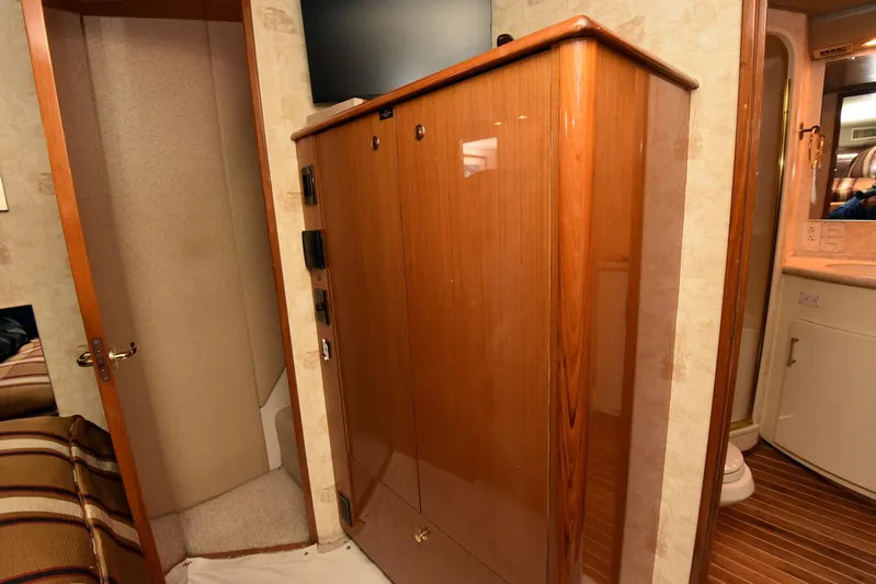 Bella Betty Yacht Photos Pics Interior of 2003 Viking 65 Enclosed Bridge yacht with wooden cabinetry and modern amenities.