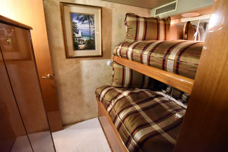 Bella Betty Yacht Photos Pics Interior of 2003 Viking 65 Enclosed Bridge with bunk beds and framed artwork.