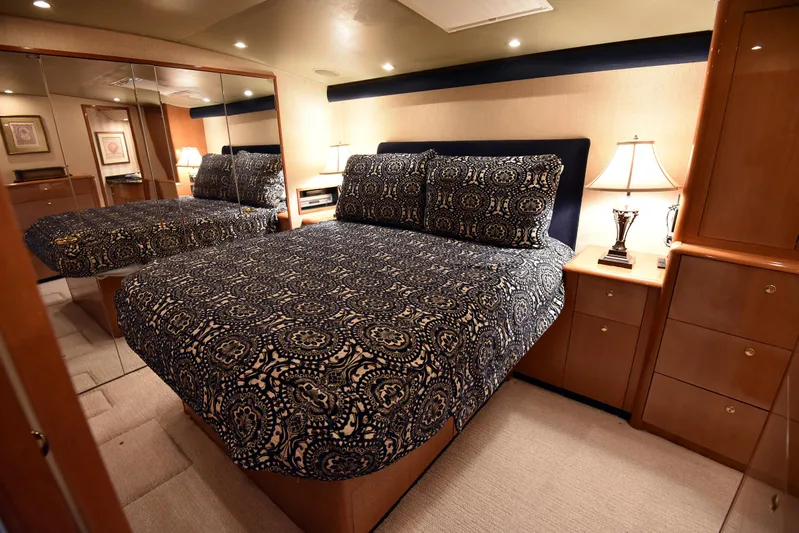 Bella Betty Yacht Photos Pics Luxurious bedroom interior of 2003 Viking 65 Enclosed Bridge yacht with elegant bedding.