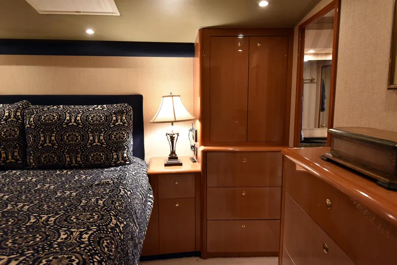 Bella Betty Yacht Photos Pics Luxurious bedroom interior of 2003 Viking 65 Enclosed Bridge yacht with elegant furnishings.