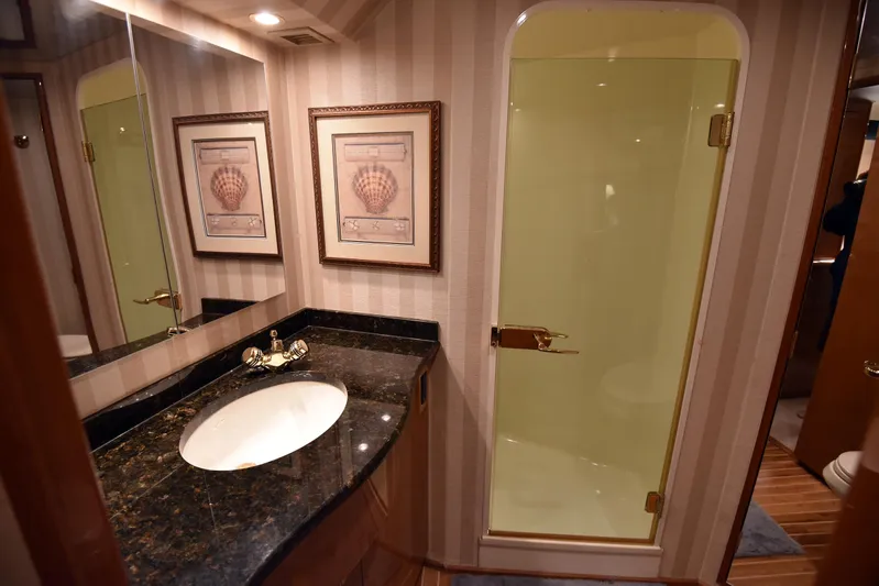 Bella Betty Yacht Photos Pics Luxurious bathroom in 2003 Viking 65 Enclosed Bridge yacht with elegant fixtures.