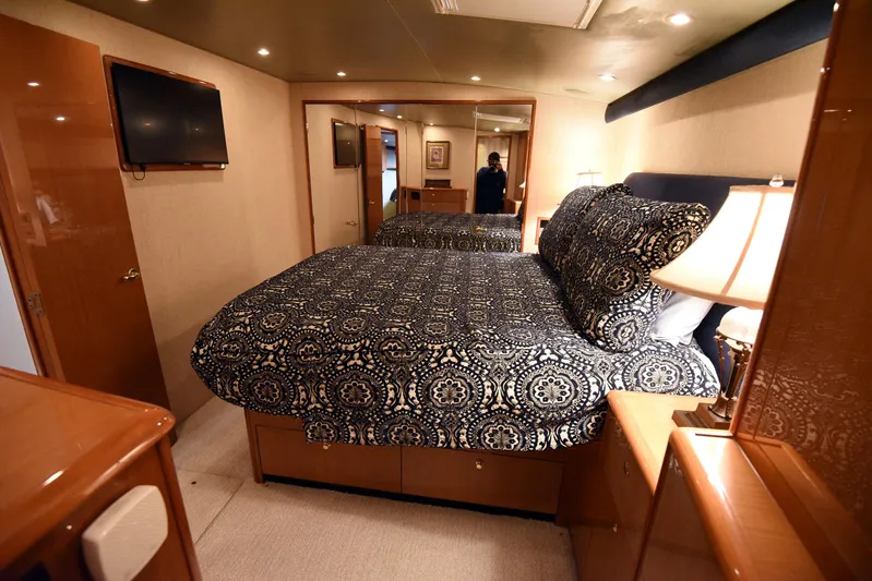 Bella Betty Yacht Photos Pics Luxurious bedroom interior of 2003 Viking 65 Enclosed Bridge yacht with elegant bedding.