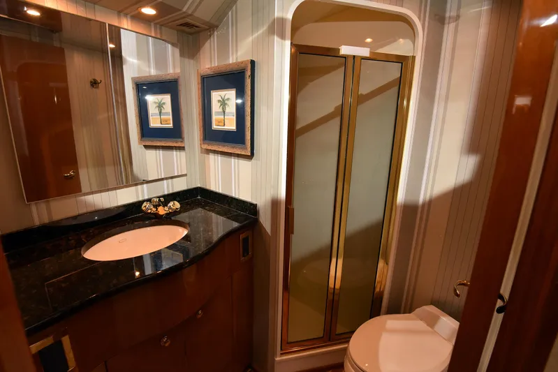 Bella Betty Yacht Photos Pics Luxurious bathroom in 2003 Viking 65 Enclosed Bridge yacht with shower and vanity.