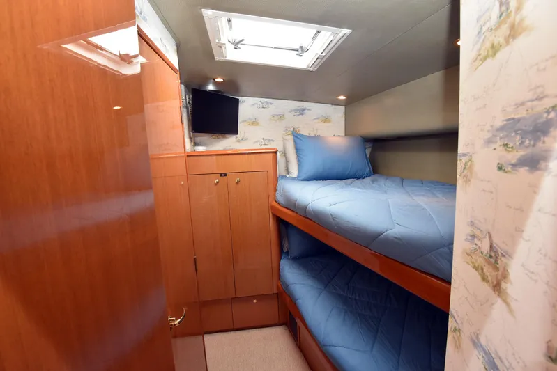 Bella Betty Yacht Photos Pics 2003 Viking 65 Enclosed Bridge cabin with bunk beds and wooden cabinetry.
