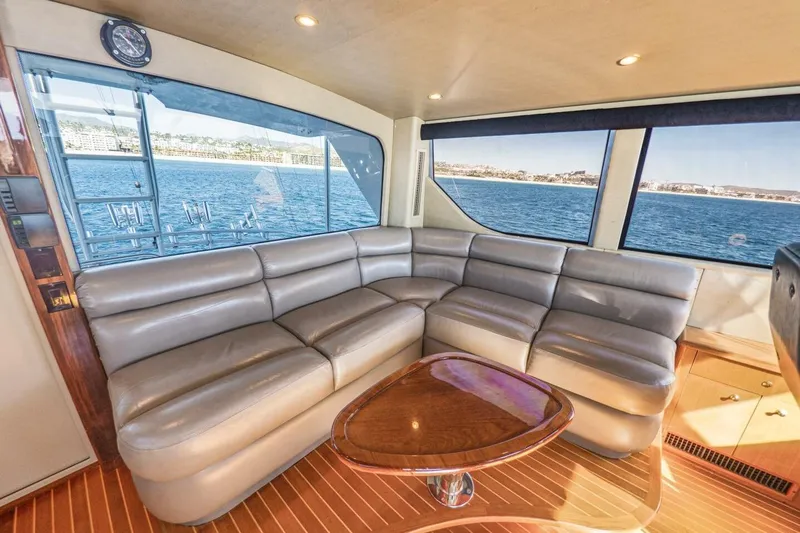 Bella Betty Yacht Photos Pics Luxurious interior of 2003 Viking 65 Enclosed Bridge yacht with leather seating and ocean view.