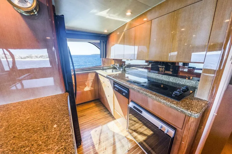 Bella Betty Yacht Photos Pics Luxurious kitchen interior of 2003 Viking 65 Enclosed Bridge yacht with ocean view.