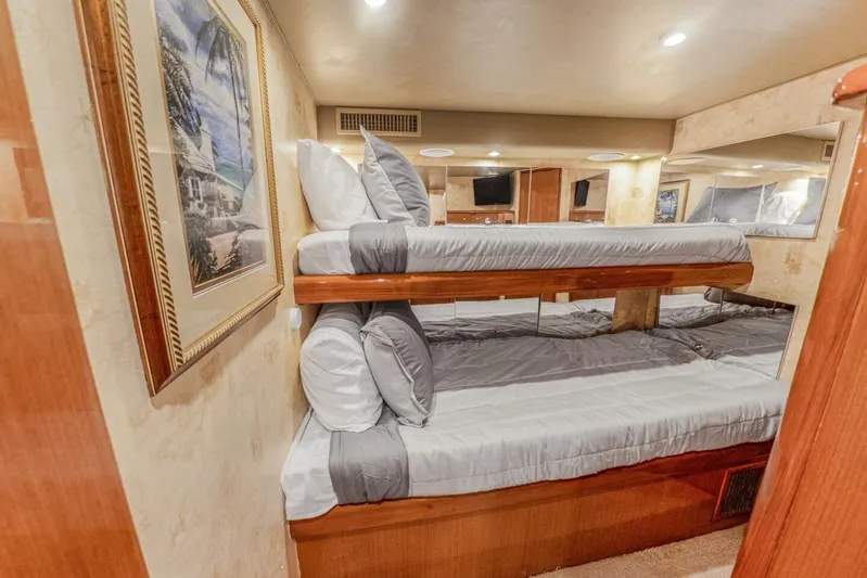 Bella Betty Yacht Photos Pics Interior of 2003 Viking 65 Enclosed Bridge yacht with cozy bunk beds and elegant decor.