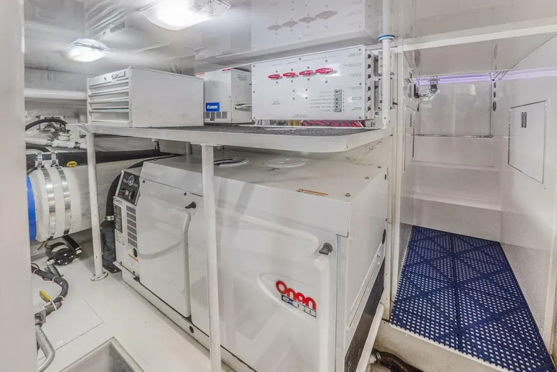 Bella Betty Yacht Photos Pics Engine room of 2003 Viking 65 Enclosed Bridge yacht with Onan generator and control panels.