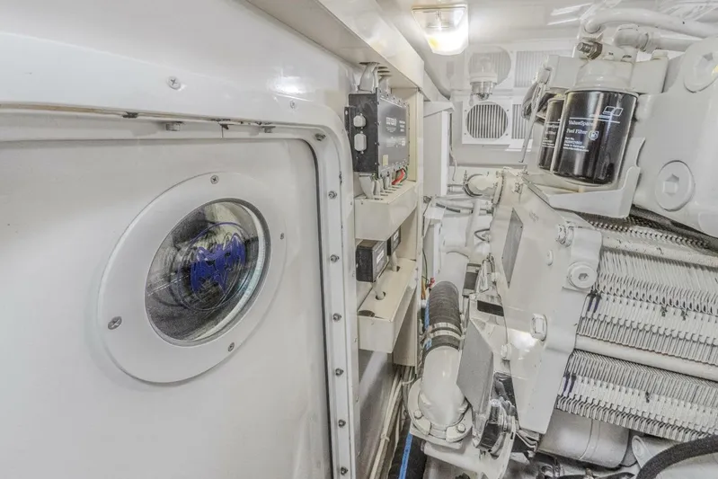Bella Betty Yacht Photos Pics Engine room of 2003 Viking 65 Enclosed Bridge yacht, showcasing mechanical components.