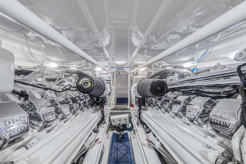 Bella Betty Yacht Photos Pics Engine room of 2003 Viking 65 Enclosed Bridge yacht, showcasing dual powerful engines.