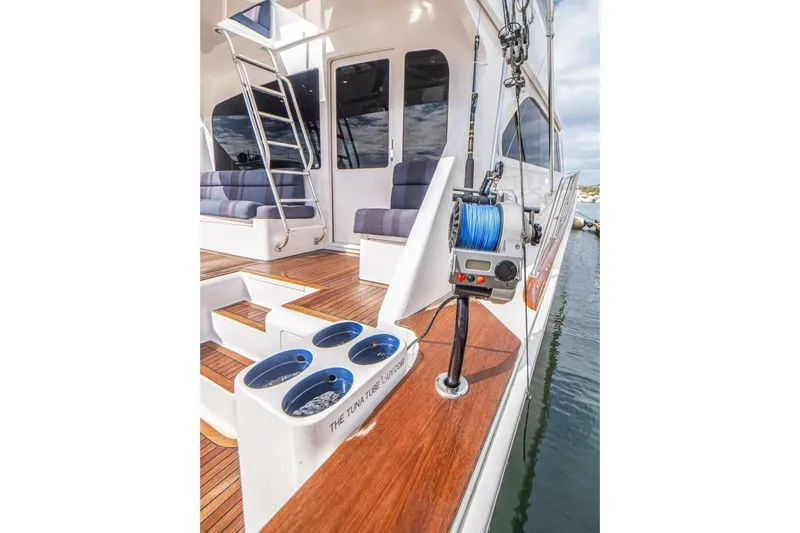 Bella Betty Yacht Photos Pics 2003 Viking 65 Enclosed Bridge yacht with fishing gear and wooden deck.