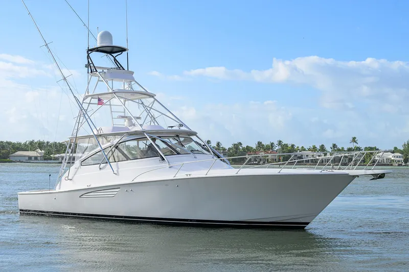  Yacht Photos Pics 2015 Viking 52 Open yacht cruising on calm waters under a clear blue sky.