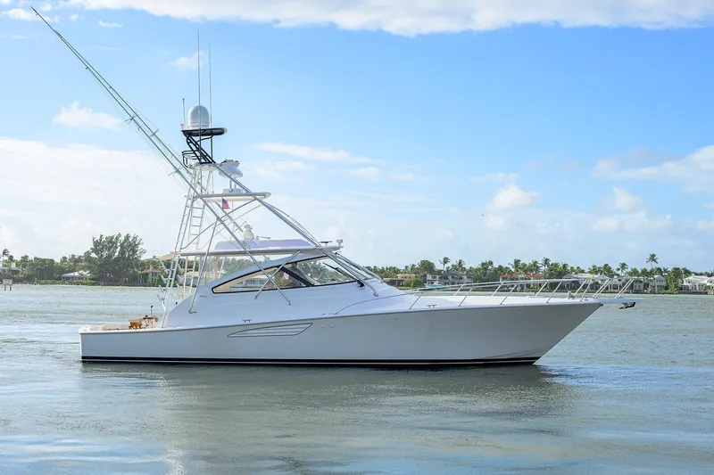  Yacht Photos Pics 2015 Viking 52 Open yacht on calm water under blue sky.
