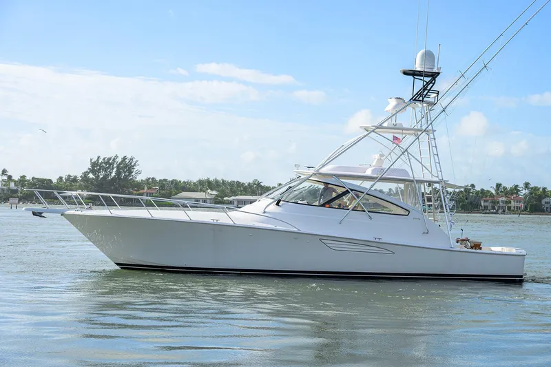  Yacht Photos Pics 2015 Viking 52 Open yacht cruising on calm waters under a clear blue sky.