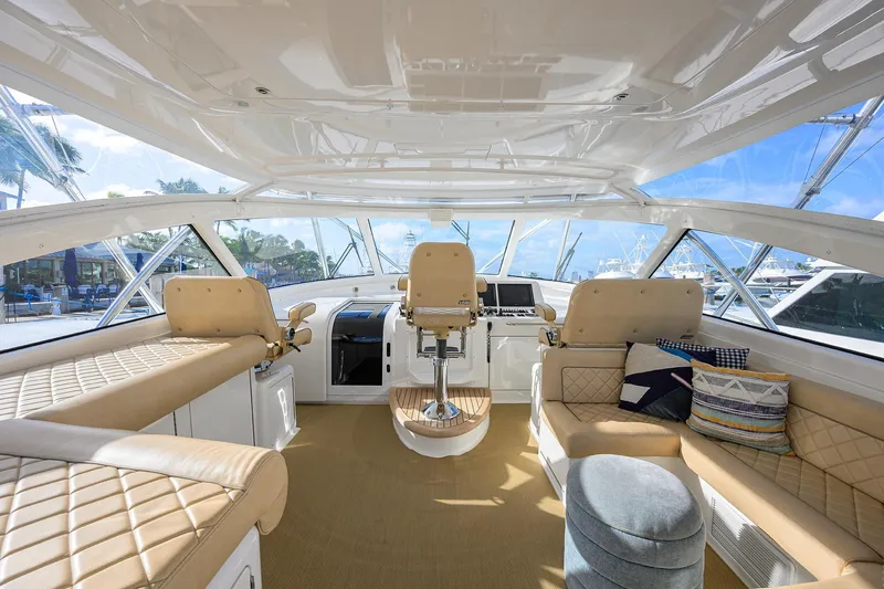  Yacht Photos Pics Luxurious interior of 2015 Viking 52 Open yacht with plush seating and helm station.