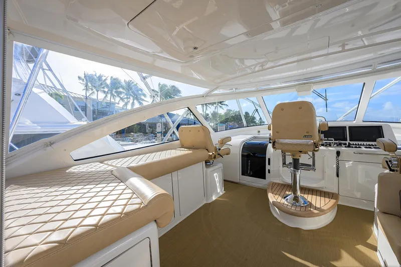 Yacht Photos Pics Luxurious interior of 2015 Viking 52 Open yacht with plush seating and modern controls.