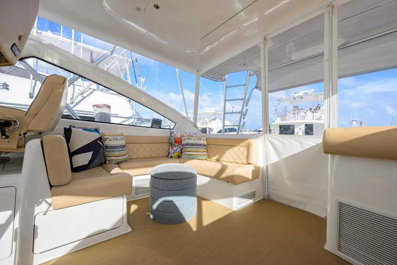  Yacht Photos Pics Luxurious interior of 2015 Viking 52 Open yacht with plush seating and nautical decor.
