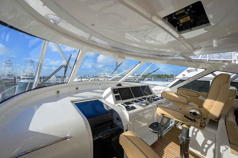  Yacht Photos Pics Interior view of 2015 Viking 52 Open yacht cockpit with modern controls and seating.