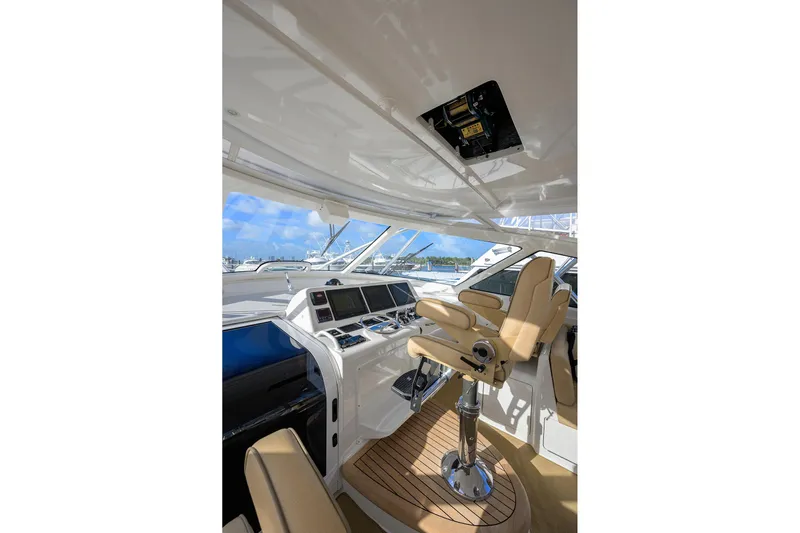 Yacht Photos Pics Interior of 2015 Viking 52 Open yacht with helm station and luxurious seating.