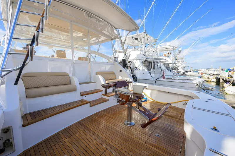  Yacht Photos Pics 2015 Viking 52 Open yacht with teak deck and seating at marina.