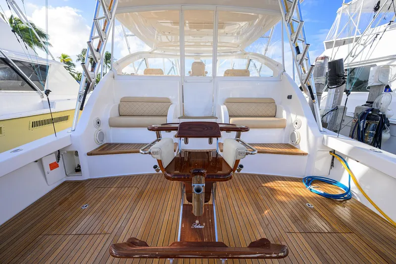  Yacht Photos Pics 2015 Viking 52 Open yacht interior with teak flooring and cushioned seating.