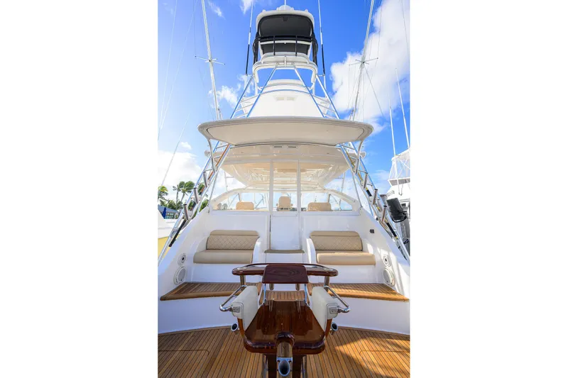  Yacht Photos Pics 2015 Viking 52 Open yacht with spacious deck and seating, under clear blue sky.