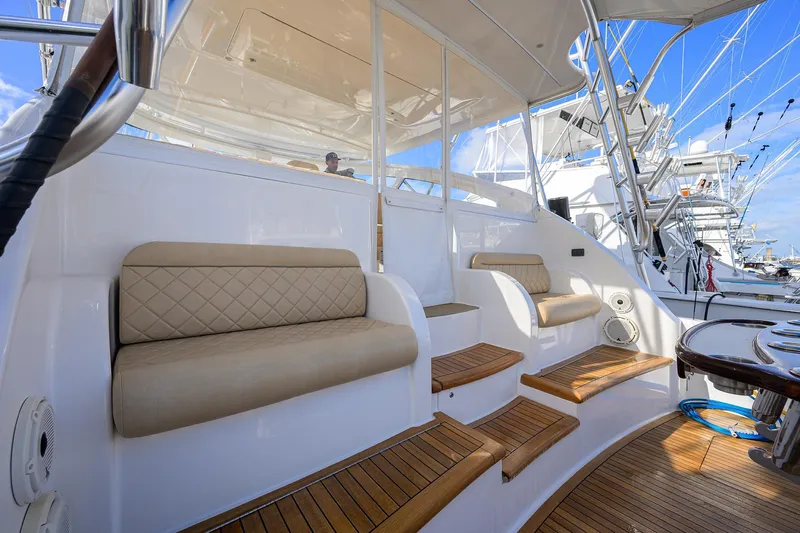  Yacht Photos Pics 2015 Viking 52 Open yacht interior with cushioned seating and wooden steps.
