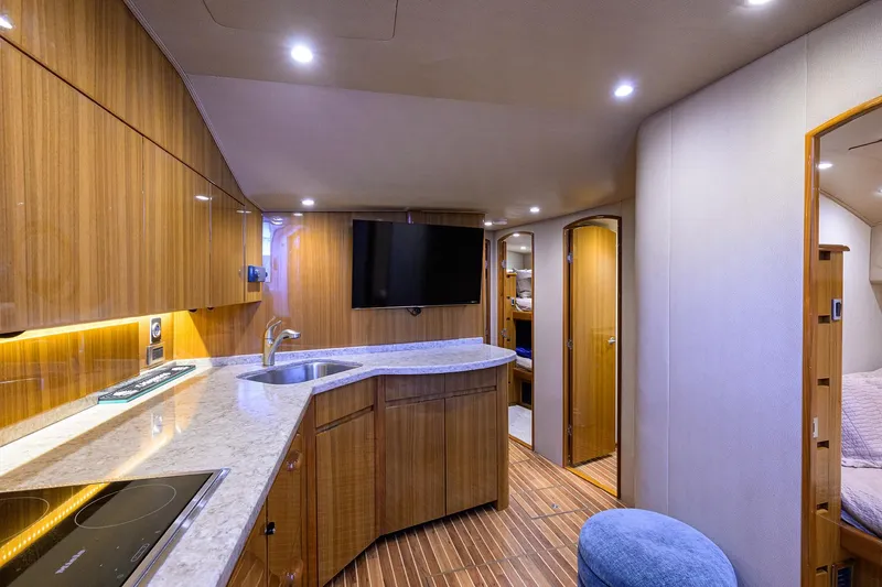  Yacht Photos Pics Luxurious interior of 2015 Viking 52 Open yacht with modern kitchen and cozy living space.