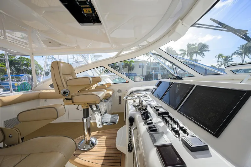  Yacht Photos Pics Luxurious helm of 2015 Viking 52 Open yacht with advanced navigation controls and leather seating.