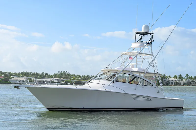  Yacht Photos Pics 2015 Viking 52 Open yacht cruising on calm waters under a clear blue sky.