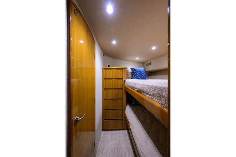  Yacht Photos Pics Interior of 2015 Viking 52 Open yacht with bunk beds and wooden cabinetry.