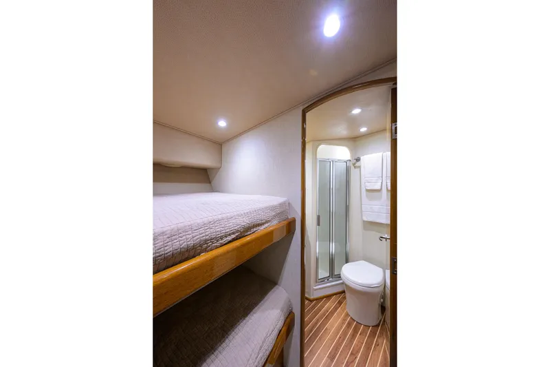  Yacht Photos Pics 2015 Viking 52 Open yacht interior with bunk beds and bathroom.