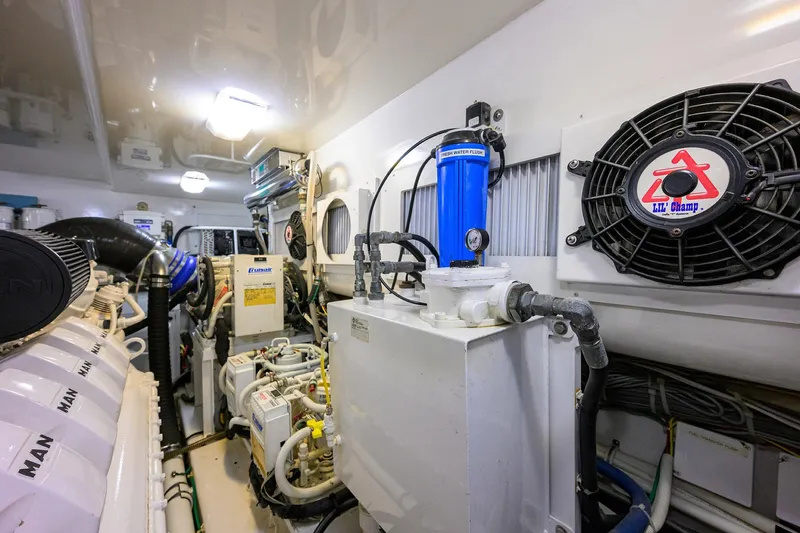  Yacht Photos Pics Engine room of 2015 Viking 52 Open yacht, showcasing machinery and equipment.