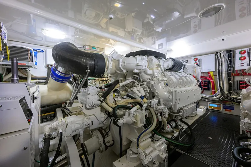  Yacht Photos Pics Engine room of a 2015 Viking 52 Open yacht, showcasing complex machinery and wiring.