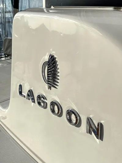 Sogno Yacht Photos Pics 2024 Lagoon 46 yacht logo on sleek white surface.