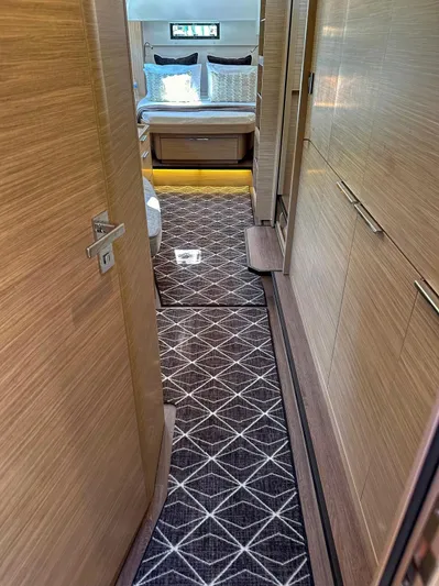 Sogno Yacht Photos Pics 2024 Lagoon 46 yacht interior hallway with modern design and elegant bedroom view.