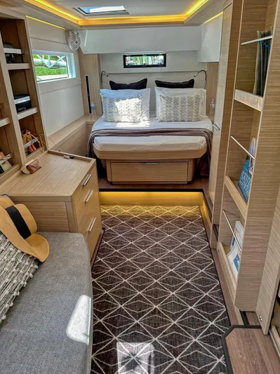 Sogno Yacht Photos Pics Luxurious interior of 2024 Lagoon 46 yacht with modern bedroom and stylish decor.