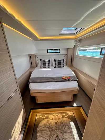 Sogno Yacht Photos Pics Luxurious 2024 Lagoon 46 yacht cabin with modern design and ambient lighting.
