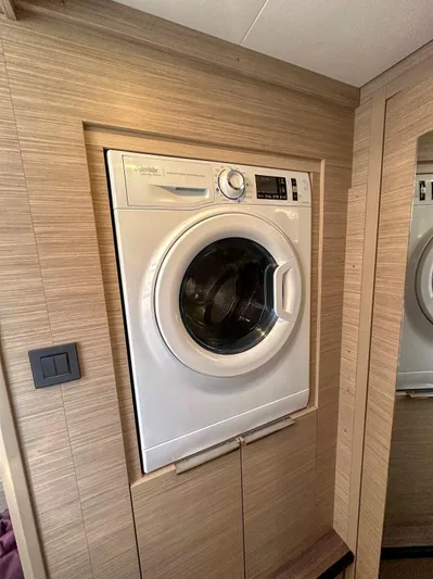Sogno Yacht Photos Pics Built-in washing machine on 2024 Lagoon 46 yacht interior.