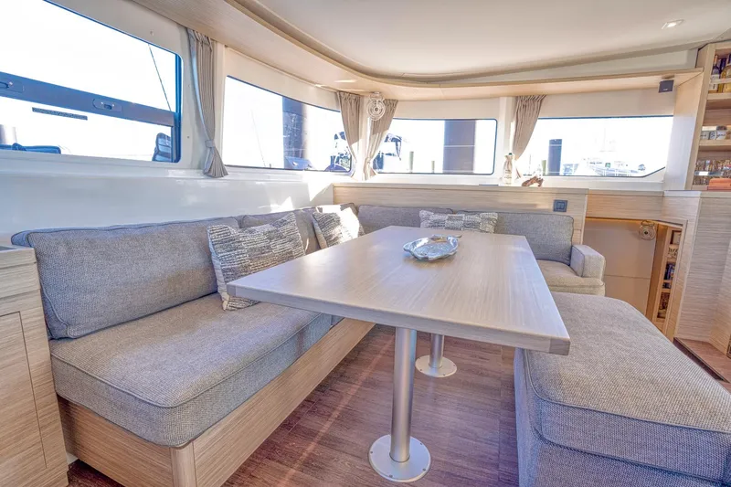 Sogno Yacht Photos Pics Luxurious interior of 2024 Lagoon 46 yacht with spacious seating and elegant decor.