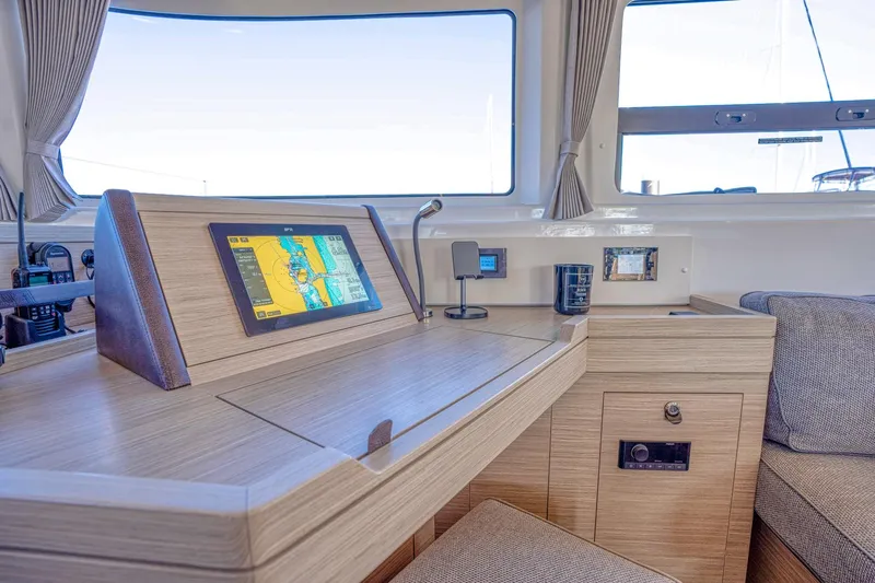 Sogno Yacht Photos Pics 2024 Lagoon 46 yacht interior with navigation system and modern wood finish.