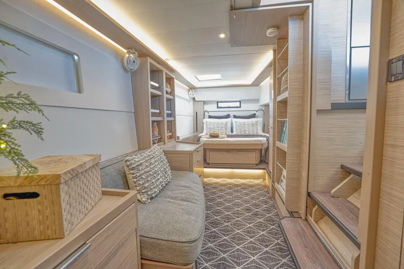 Sogno Yacht Photos Pics Luxurious interior of 2024 Lagoon 46 yacht with cozy seating and elegant bedroom.