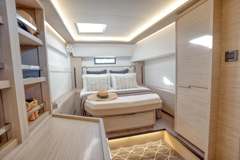 Sogno Yacht Photos Pics Luxurious interior of 2024 Lagoon 46 yacht with modern bedroom design.