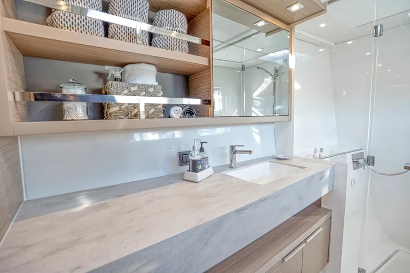 Sogno Yacht Photos Pics Luxurious bathroom in 2024 Lagoon 46 yacht with modern fixtures and elegant design.